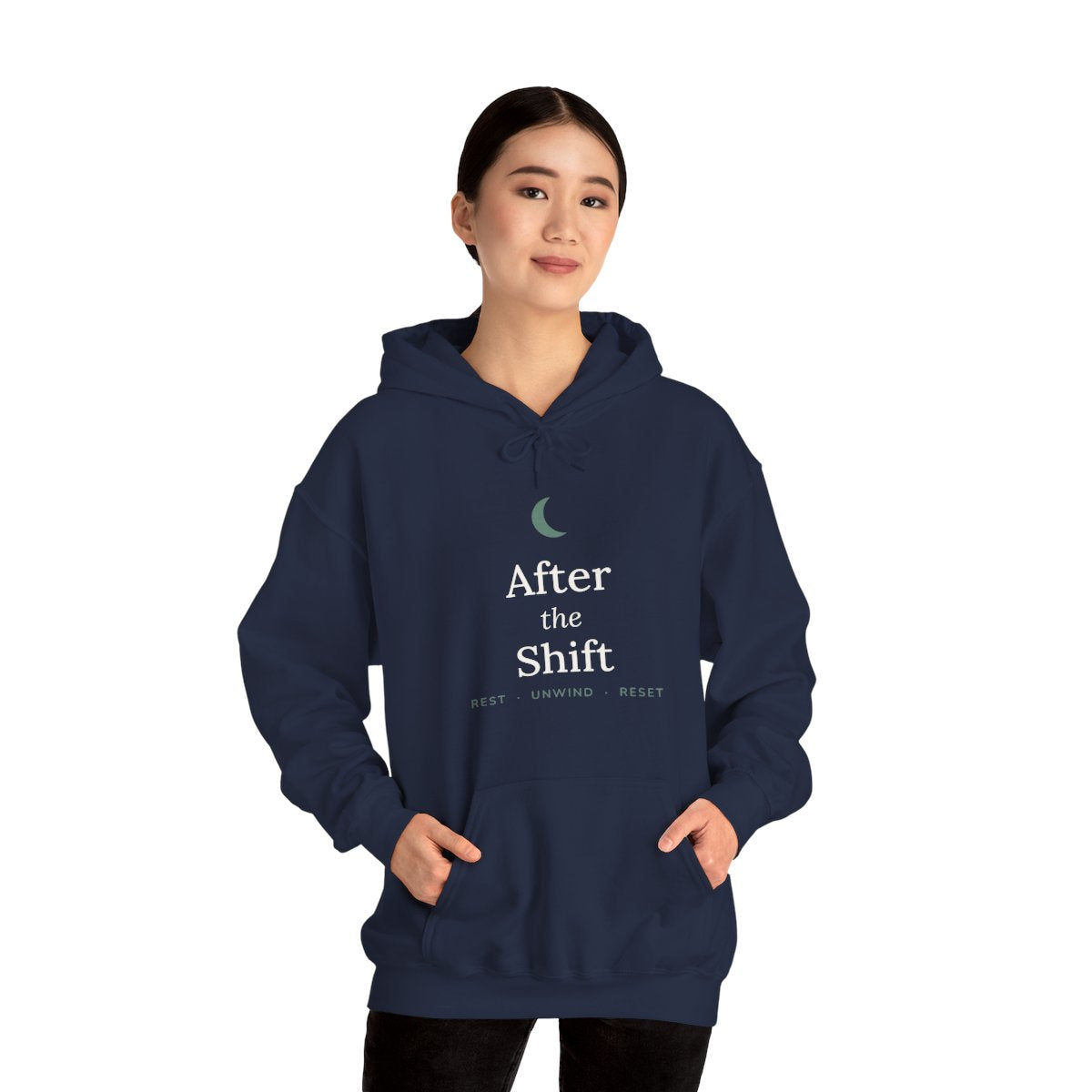 Navy "After the Shift" hoodie worn with hands in the front pocket