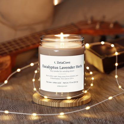 Lit Eucalyptus Lavender Herb candle on a wooden coaster with soft string lights