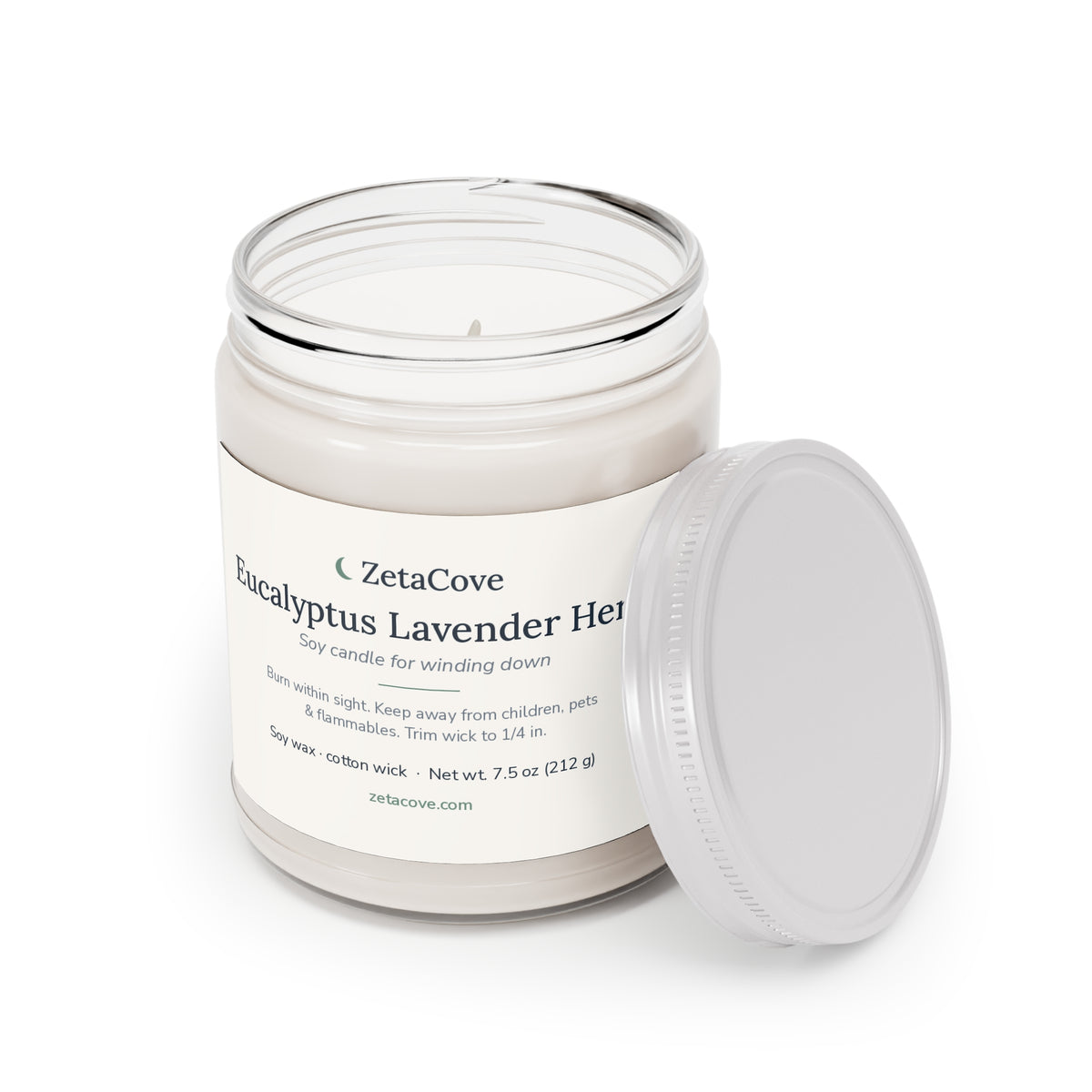 The soy candle with its white lid off