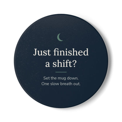 Round Cove ceramic coaster in navy with the words "Just finished a shift?" and "Set the mug down. One slow breath out."